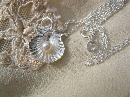 Scallop shell and pearl necklace for wellbeing