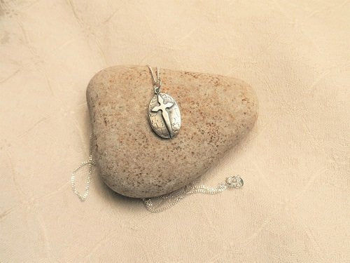 St James cross with Angel charm to wish safe journey
